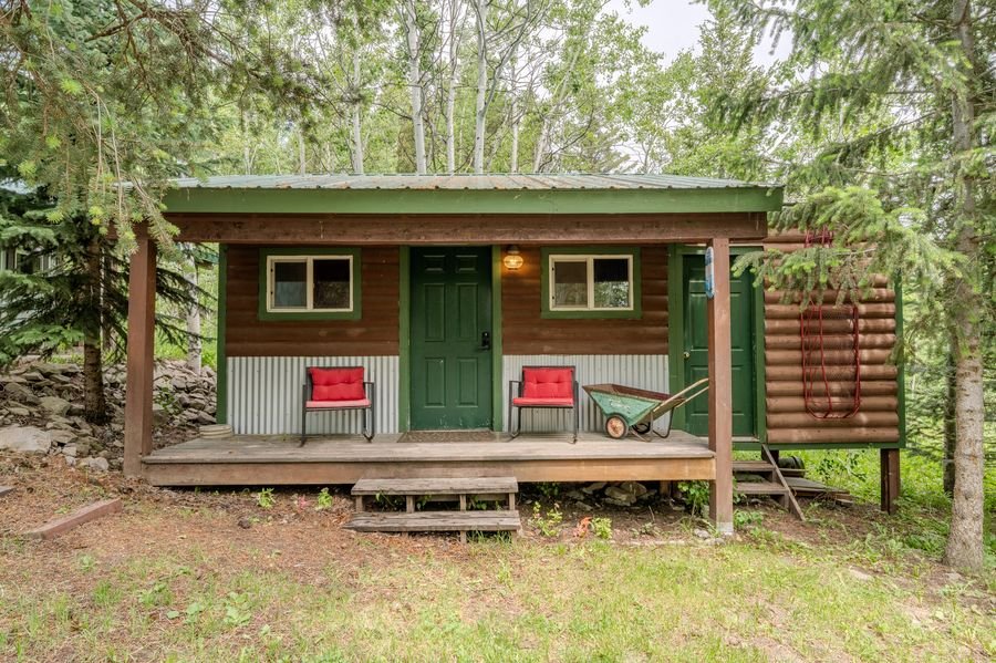 Bunkhouse with covered porch — forest setting