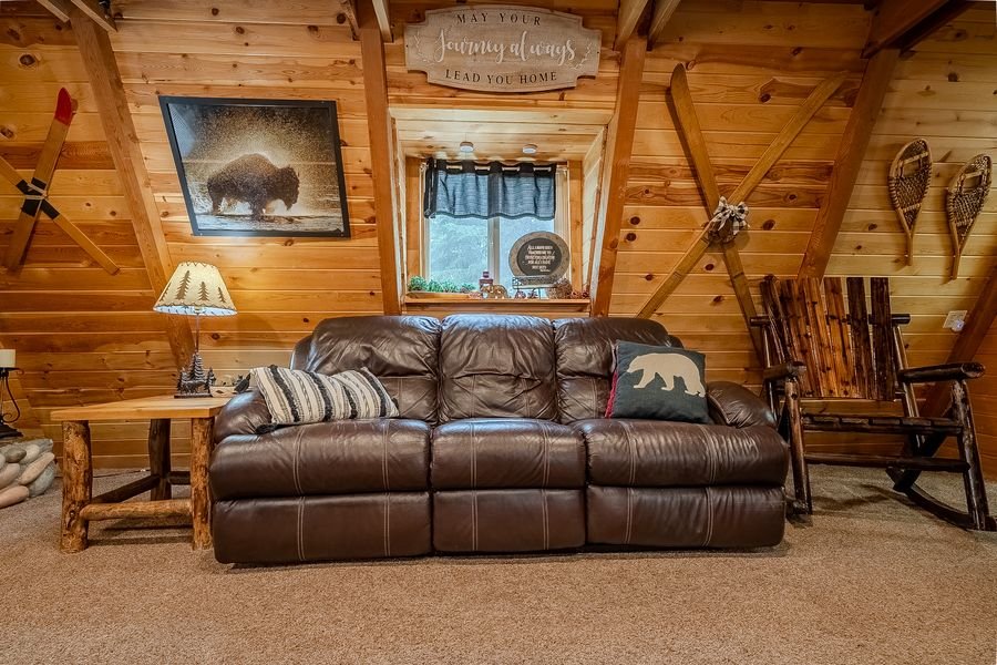Living room detail — bison art and log decor