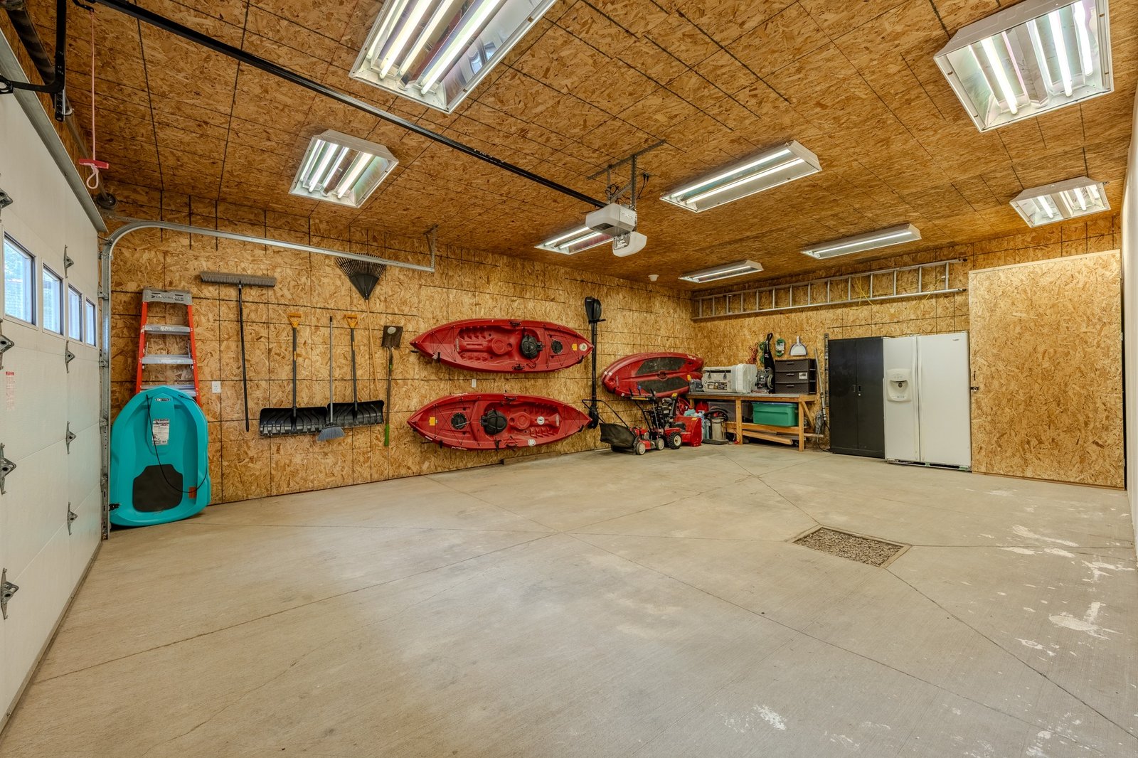 Large garage with kayaks and gear storage