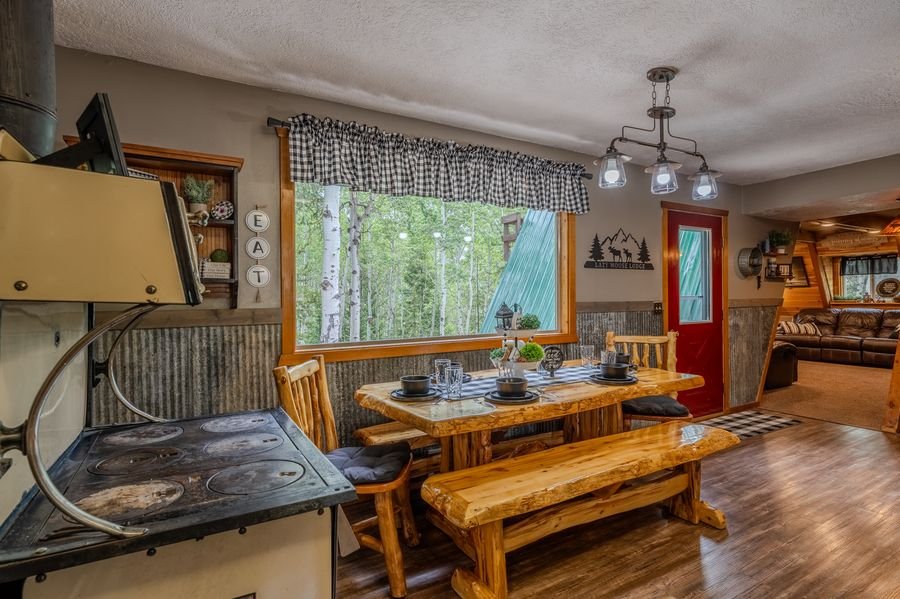 Kitchen with stone island and dining area