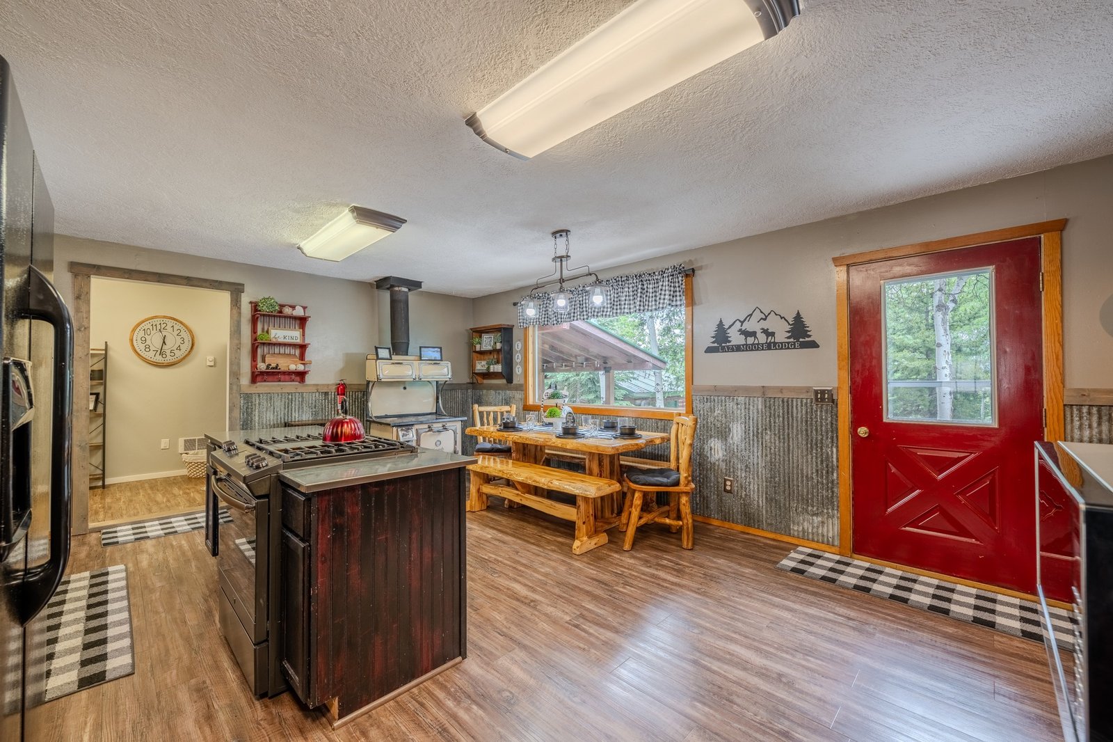 Kitchen and dining area with red door