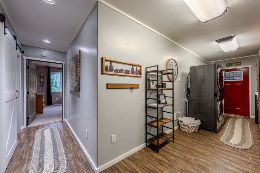 Hallway and laundry with double washer dryer