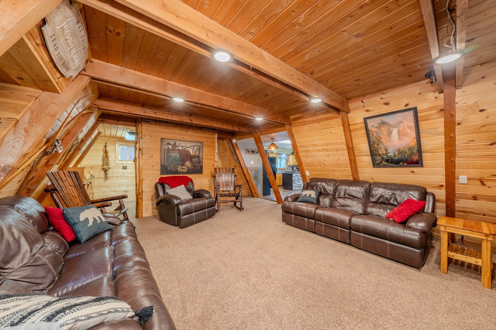 Living room with leather seating and wood interior