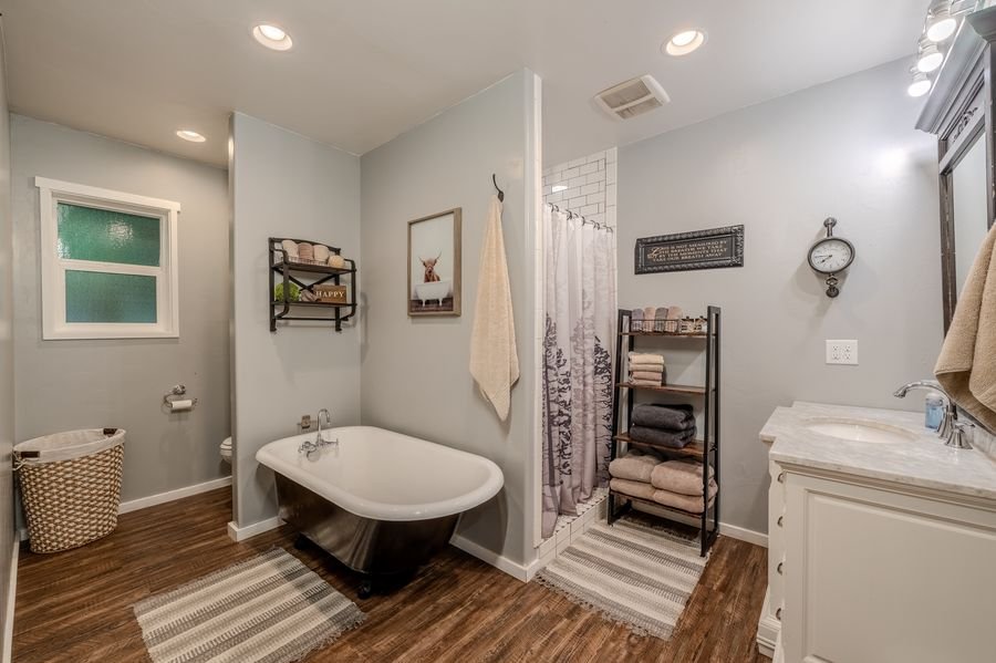 Master bathroom with clawfoot tub and separate shower