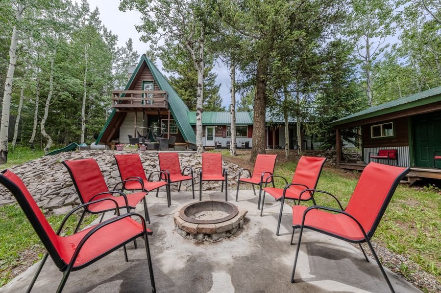 Fire pit area with A-frame in background