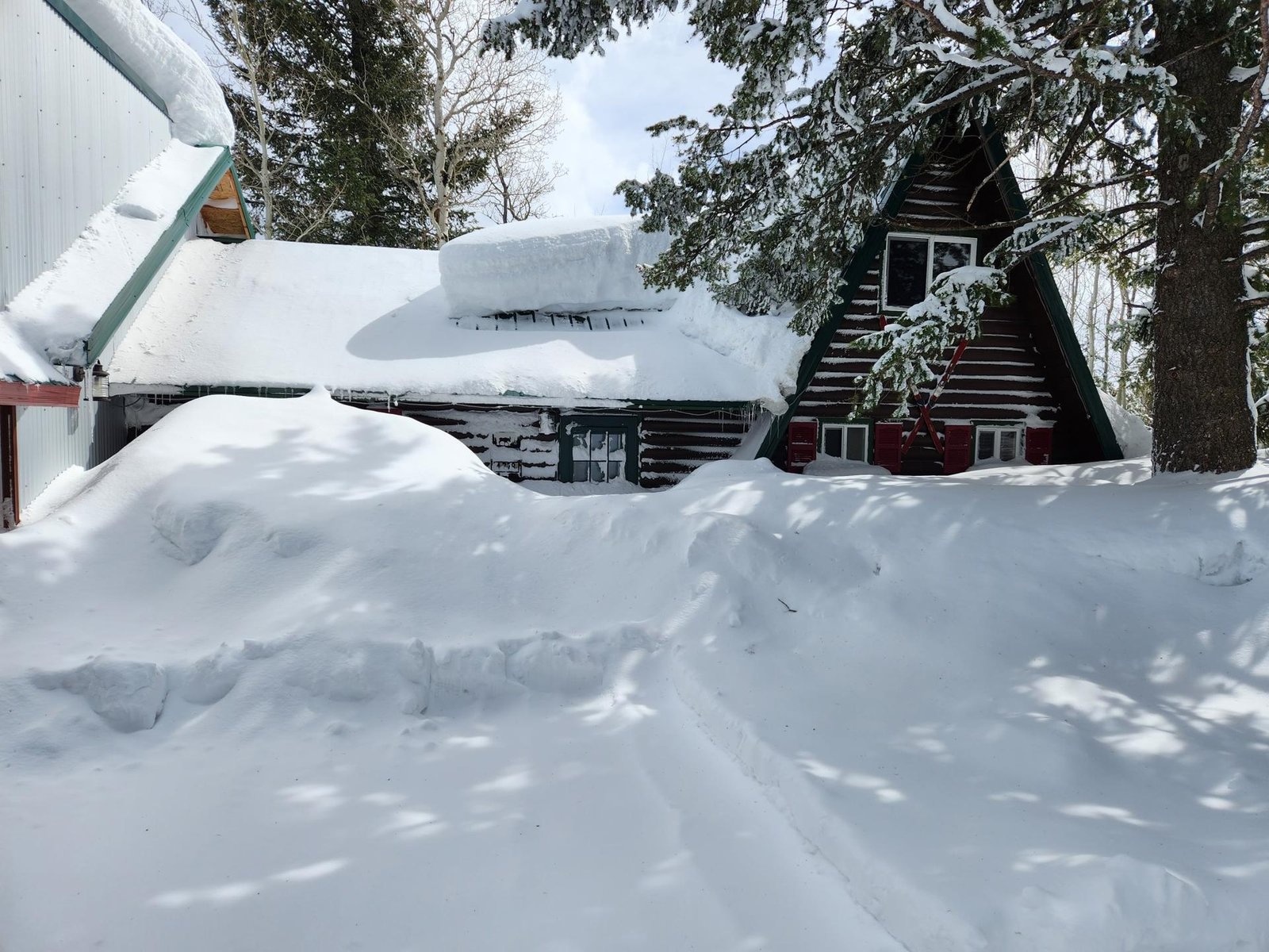 Lazy Moose Lodge A-frame cabin in deep snow, Island Park, Idaho